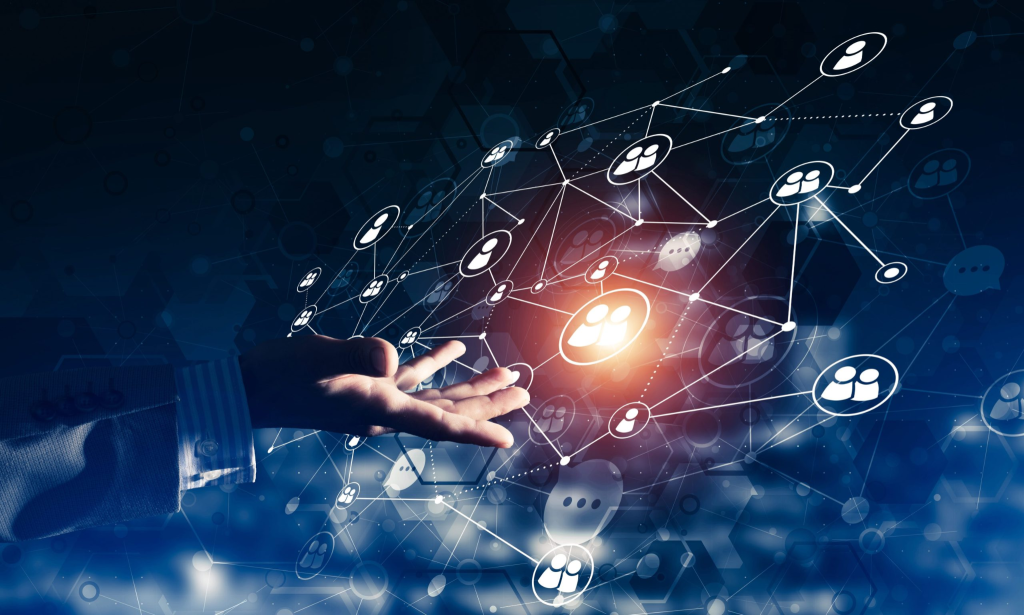 A hand reaching toward a glowing network of interconnected icons representing people, symbolizing digital communication and social networking.
